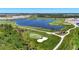 Beautiful golf course featuring lush green fairways and a serene lake at 12140 Wellen Golf St # 401, Venice, FL 34293
