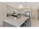 Bright kitchen features a large center island with seating and stainless steel appliances at 12140 Wellen Golf St # 401, Venice, FL 34293