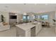 Open kitchen design flows into a living room and dining area for comfortable entertaining at 12140 Wellen Golf St # 401, Venice, FL 34293
