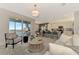 Relax in this bright living area with large windows and sliding doors with an open kitchen concept at 12140 Wellen Golf St # 401, Venice, FL 34293