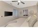 Comfortable main bedroom with a mounted TV and calming color scheme at 12140 Wellen Golf St # 401, Venice, FL 34293