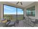 Relaxing screened-in patio with comfortable seating and a scenic golf course view at 12140 Wellen Golf St # 401, Venice, FL 34293