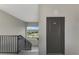 View of a stairwell leading to a door labeled 401 with a window offering a view of a golf course at 12140 Wellen Golf St # 401, Venice, FL 34293