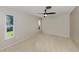 Neutral bedroom with carpet, ceiling fan, and natural light from two windows at 1234 Pinebrook Way, Venice, FL 34285