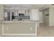Modern kitchen with stainless steel appliances, stylish cabinets, and a spacious breakfast bar at 1234 Pinebrook Way, Venice, FL 34285