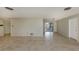 Large open living area with tile flooring, neutral paint, and an open floorplan at 1234 Pinebrook Way, Venice, FL 34285