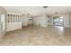 Spacious living area with tile flooring, bright natural light, and an open layout at 1234 Pinebrook Way, Venice, FL 34285