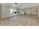 Open living area with tile flooring, and bright windows offering plenty of natural light at 1234 Pinebrook Way, Venice, FL 34285