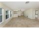 Bright living space with tile floors, large windows, and an open and airy feel at 1234 Pinebrook Way, Venice, FL 34285