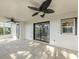 Covered patio with ceiling fans, tile flooring, and natural light at 1234 Pinebrook Way, Venice, FL 34285