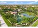 Aerial view of the community sports courts surrounded by lush landscaping at 1254 Cielo Ct, North Venice, FL 34275