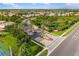 Aerial view of the community entrance with manicured landscaping and water features at 1254 Cielo Ct, North Venice, FL 34275