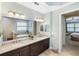 Bathroom featuring granite countertops, dual sinks and a bathtub at 1254 Cielo Ct, North Venice, FL 34275