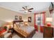 Cozy bedroom with ceiling fan, neutral colors, and coordinated decor at 1254 Cielo Ct, North Venice, FL 34275