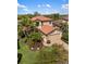 Two-story home with a tile roof, manicured landscaping, and a two car garage at 1254 Cielo Ct, North Venice, FL 34275