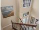 Staircase featuring decorative iron railing and a view to the front door entry at 1254 Cielo Ct, North Venice, FL 34275
