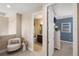 Hallway with view to a bathroom and bedroom with seating arrangement at 1254 Cielo Ct, North Venice, FL 34275