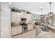 Well-equipped kitchen featuring granite countertops, stainless steel appliances, and modern lighting fixtures at 1254 Cielo Ct, North Venice, FL 34275