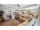 Spacious living area features open floor plan with kitchen, dining, and seating, perfect for entertaining guests at 1254 Cielo Ct, North Venice, FL 34275