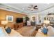Living room featuring a large area rug, comfortable seating, and stylish decor at 1254 Cielo Ct, North Venice, FL 34275