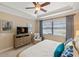 Main bedroom featuring a calming view of the water, blinds, and curtains for privacy at 1254 Cielo Ct, North Venice, FL 34275