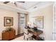 Cozy office with stylish furniture, natural light, and a map wall decoration for a creative workspace at 1254 Cielo Ct, North Venice, FL 34275