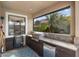 Outdoor kitchen featuring a built-in grill, granite countertops, and ample cabinet space at 1254 Cielo Ct, North Venice, FL 34275