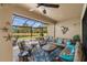 Screened patio with ample seating and a picturesque view of the lake at 1254 Cielo Ct, North Venice, FL 34275