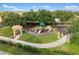 Community playground featuring modern equipment and shaded seating areas at 1254 Cielo Ct, North Venice, FL 34275