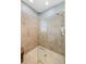 Modern tiled shower features glass doors, rainfall shower head, and neutral tile surround at 1254 Cielo Ct, North Venice, FL 34275
