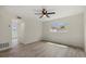 Bright bedroom with tiled floors, a ceiling fan, and natural light from a single window at 1258 Barbara Dr # 105, Venice, FL 34285