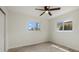 Bedroom with tile floors, closet, a ceiling fan, and natural light from windows at 1258 Barbara Dr # 105, Venice, FL 34285