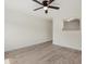 Open-concept living room with tile floors and natural light, freshly painted neutral walls at 1258 Barbara Dr # 105, Venice, FL 34285