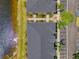 Overhead view showing the building's layout near a picturesque lake and convenient parking area at 12983 Tigers Eye Dr, Venice, FL 34292