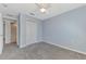 This carpeted bedroom features light blue walls and a closet at 12983 Tigers Eye Dr, Venice, FL 34292