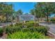 Stoneywood Cove Townhomes sign surrounded by green foliage at 12983 Tigers Eye Dr, Venice, FL 34292