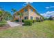 Spacious two-story home with a well-manicured lawn and lush landscaping at 12983 Tigers Eye Dr, Venice, FL 34292