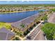 Lakefront townhomes with manicured landscaping, and convenient parking, offering serene community living at 12983 Tigers Eye Dr, Venice, FL 34292