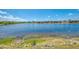 A beautiful lake view with a blue sky overhead at 12983 Tigers Eye Dr, Venice, FL 34292