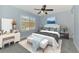 Serene bedroom with a plush bed, soft lighting, and a window offering a pleasant outdoor view at 12983 Tigers Eye Dr, Venice, FL 34292