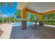 Community pool with lounge chairs and shade at 12983 Tigers Eye Dr, Venice, FL 34292