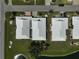 Overhead view showing the tile roofs and landscaping of the villas at 131 Sandstone Cir, Venice, FL 34293