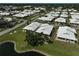 A scenic view of the neighborhood and pond near the villa at 131 Sandstone Cir, Venice, FL 34293