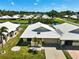 A high angle view of the roof, yard, and a lake nearby at 131 Sandstone Cir, Venice, FL 34293