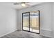 Bedroom with sliding glass door to outside at 131 Sandstone Cir, Venice, FL 34293