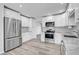 Updated kitchen featuring stainless steel appliances and white cabinets at 131 Sandstone Cir, Venice, FL 34293