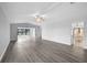 Bright living room with modern flooring and ceiling fan at 131 Sandstone Cir, Venice, FL 34293