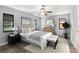 Well-lit main bedroom with a comfortable bed and complementary décor at 131 Sandstone Cir, Venice, FL 34293