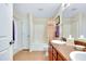 A spacious bathroom featuring a shower-tub combination, double sinks, and ample counter space at 13452 High Springs Ave, Port Charlotte, FL 33981