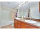 A spacious bathroom featuring a shower-tub combination, double sinks, and ample counter space at 13452 High Springs Ave, Port Charlotte, FL 33981